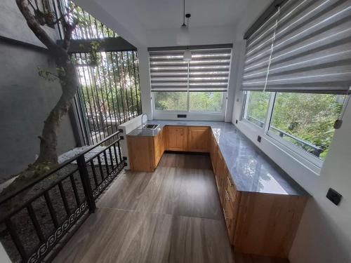 a room with a large window with a bench at Highgarden Hideaway Villa - Gampola in Gampola