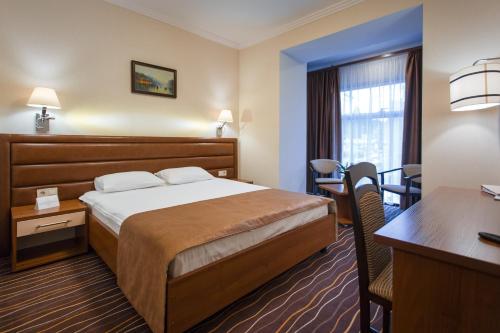 Postel nebo postele na pokoji v ubytování Abri Hotel