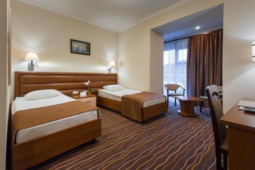 Postel nebo postele na pokoji v ubytování Abri Hotel