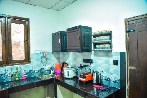 a kitchen with a sink and a counter top at Misty Peaks Villa in Haldummulla