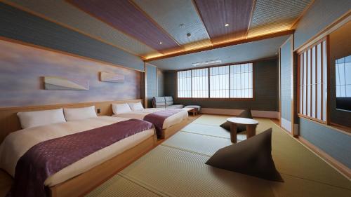 a hotel room with two beds and a television at かっぱの宿旅館三治郎 in Zao
