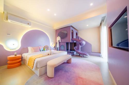 a childs bedroom with a bed and a slide at Candy House Private Pool Villa & KTV in Ban Nong Chaeng