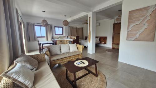 a living room with a couch and a table at yamba pacifico in San Isidro