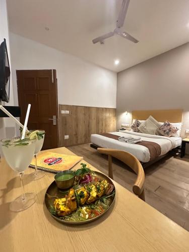 a hotel room with a plate of food on a table at Hotel KG Estate in Jaipur