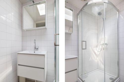 a bathroom with a glass shower and a sink at Buitenplaats Herkingen 25-A in Herkingen