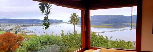 a large window with a view of a body of water at Paradise Private Zen Studios in Knysna