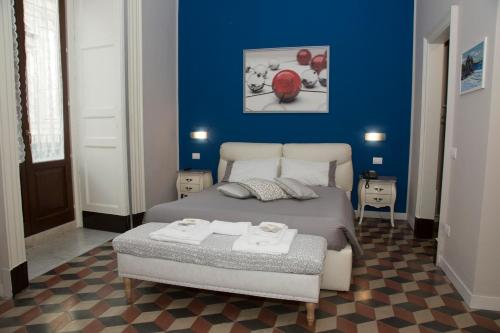Postel nebo postele na pokoji v ubytování B&B Suite Cutelli