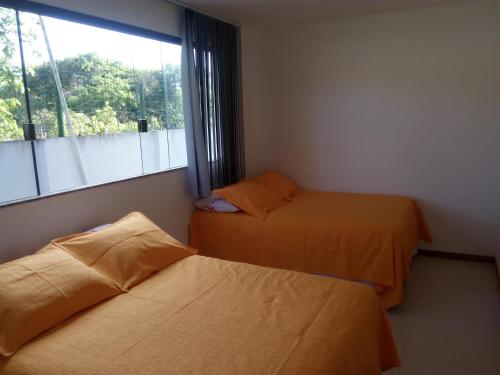 Cama o camas de una habitación en Apartamento Imbassai