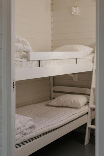 a couple of bunk beds in a room at Mösseberg Camping in Falköping