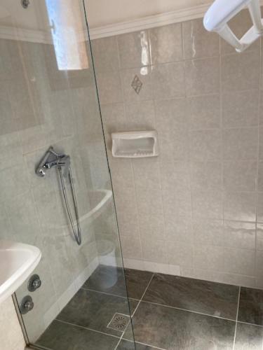 a shower with a glass door in a bathroom at Agistri Island Dream in Skala