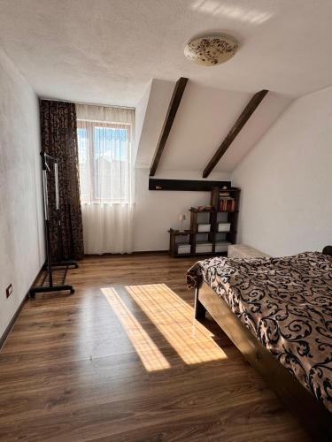 a bedroom with a bed and a window at Voila House in Voila