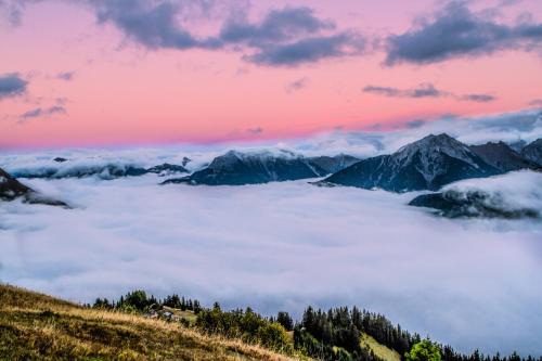 a view of the mountains above the clouds at Hotel Alpenblick in Bach