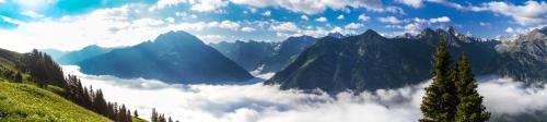 a view of a mountain valley with clouds at Hotel Alpenblick in Bach