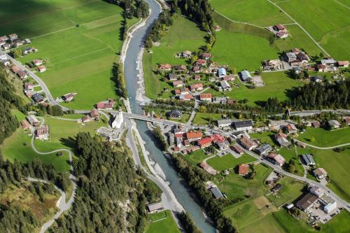 an aerial view of a village with a river at Hotel Alpenblick in Bach