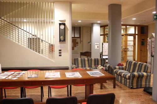 a dining room with a table and chairs at Ospitalità San Tommaso d'Aquino in Bologna