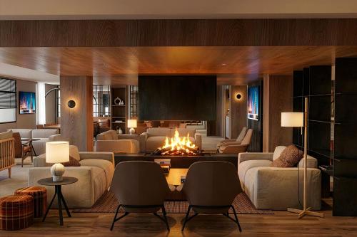 a living room with a fire in the middle at Hotel Himàlaia Soldeu by Nexta in Soldeu