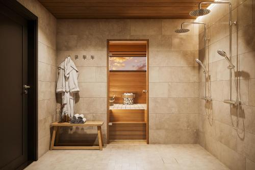 a bathroom with a shower and a walk in shower at TAHKO LAKESIDE VILLA D 1 in Tahkovuori