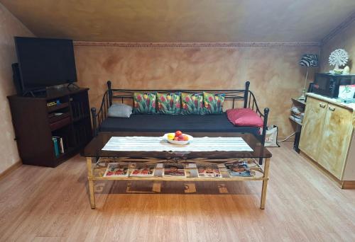 a living room with a couch and a coffee table at Ferienwohnung Rieder in Wörgl