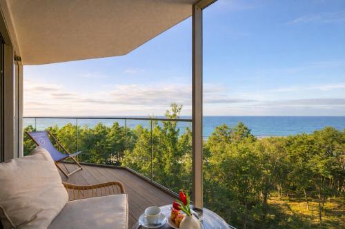 a view of the ocean from the balcony of a house at Prestige 613 - tuż przy plaży - basen, sauna, jacuzzi w cenie pobytu - Easy - Rent Apartments in Pobierowo