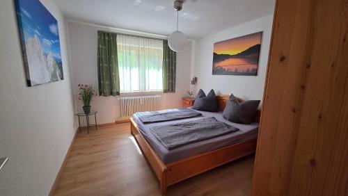 a bedroom with a bed in the middle of it at Allgäuer Ausblick in Missen-Wilhams