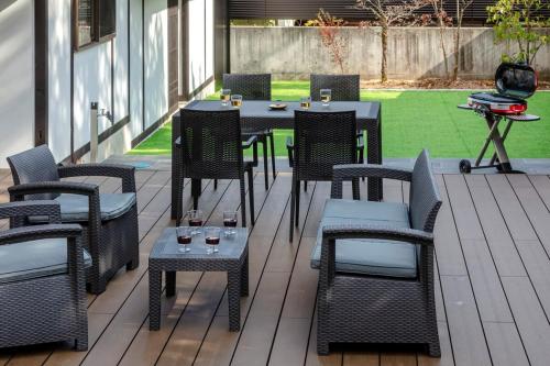 a group of tables and chairs on a patio at Anto Azumino in Azumino