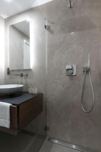 a bathroom with a shower and a sink at Aparthotel Residence Agenda in Brussels