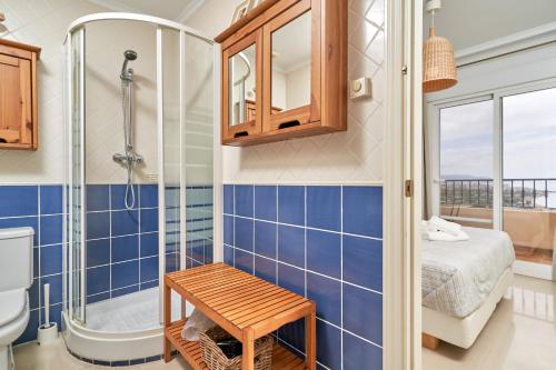 a bathroom with a shower and a toilet and a sink at Balcon Bella Vista in Nerja