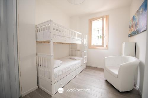 a white bunk bed in a room with a toilet at Garda Nest in Padenghe sul Garda