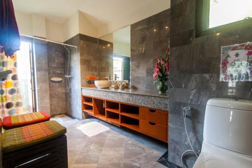 a bathroom with a shower and a toilet and a sink at Southern Lanta B9 in Ko Lanta