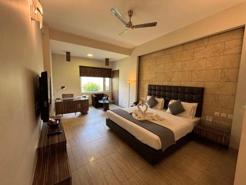 a bedroom with a large bed in a room at Hotel Residency in Jalandhar