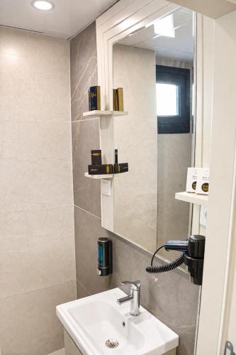 a bathroom with a sink and a mirror at Casa Ayris Boutique Hotel in Mersin