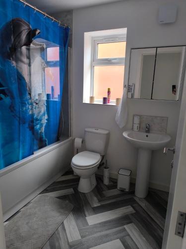 a bathroom with a toilet and a sink at Teddy's in Immingham