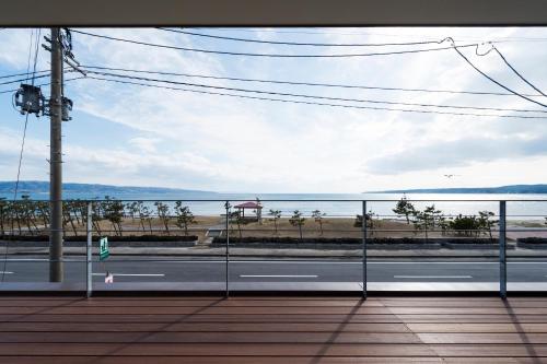 a view of the ocean from a balcony at Guest Villa on the BI-CHI in Sado