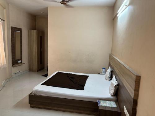 a bedroom with a bed in a room at grand empark in Bangalore