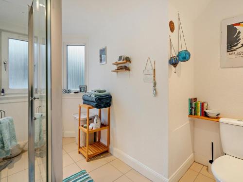 a bathroom with a shower and a toilet at 1 Bed in Burntisland oc-47388 in Kinghorn