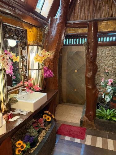 a bathroom with a sink and a mirror at P P Garden Home Bungalow in Phi Phi Islands