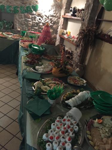 a buffet with many plates of food on a table at Agriturismo Il Pozzo in Polla