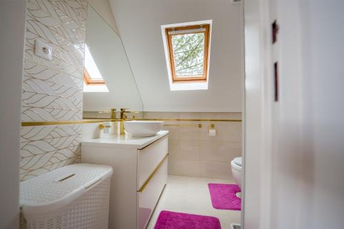 a bathroom with a sink and a toilet at Drevenička U Ježka in Ždiar