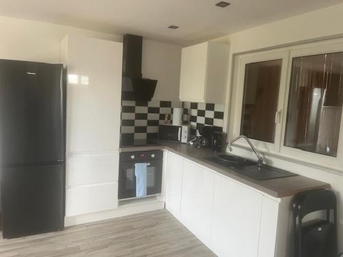 Dapur atau dapur kecil di Petite maison chaleureuse