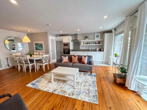 a living room with a couch and a table at Apartments in Dingle Town Center in Dingle