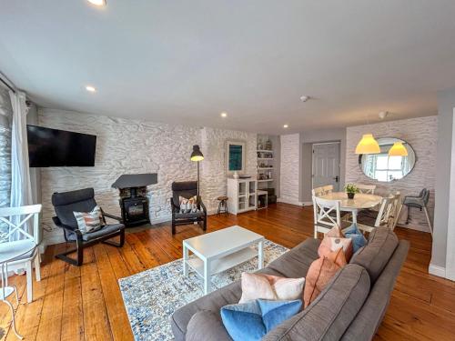 a living room with a couch and a table at Apartments in Dingle Town Center in Dingle
