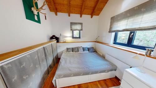 a small room with a bed in the corner at Tschuggen TU14 in Blatten bei Naters