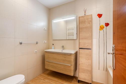 a bathroom with a sink and a mirror at Villa Florida in Lloret de Mar