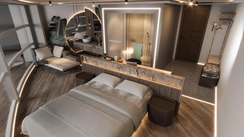 an overhead view of a bedroom with a bed and a bathroom at The Corner Park Hotel in Antalya