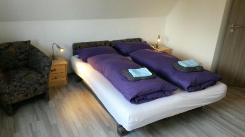En eller flere senge i et værelse på Ferienhaus Familienglück