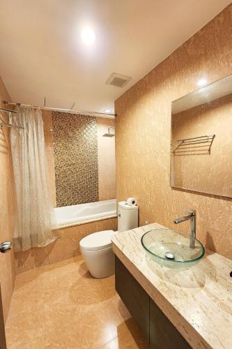 a bathroom with a toilet and a sink at Tetris Hotel in Ao Nang Beach