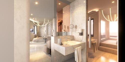 a bathroom with a large sink and a tub at The Corner Park Hotel in Antalya