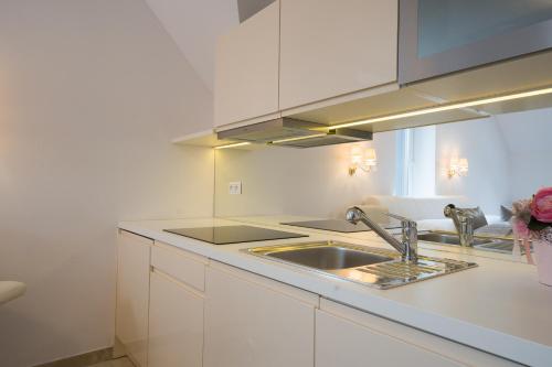 a kitchen with a sink and a counter top at Apartmany U Jezka in Ždiar
