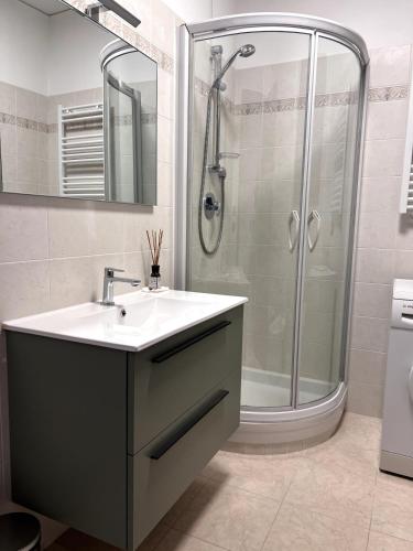 a bathroom with a sink and a shower at Appartamento 37 Varazze in Varazze