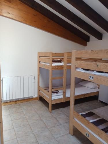a room with bunk beds in a room at Amaiurko Aterpetxea in Maya del Baztán